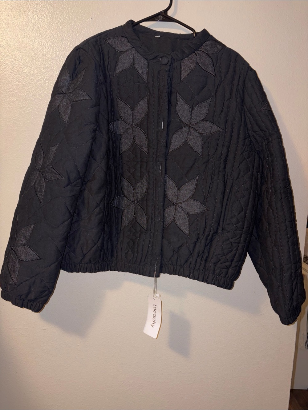 Black Quilted Bomber Jacket with Subtle Floral Applique